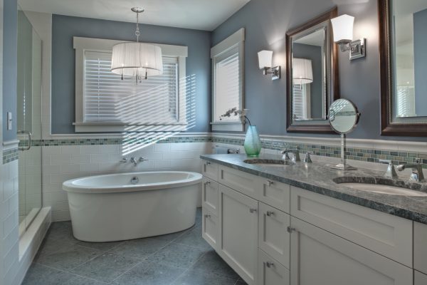 Bathtub, toilet and sink in modern bathroom