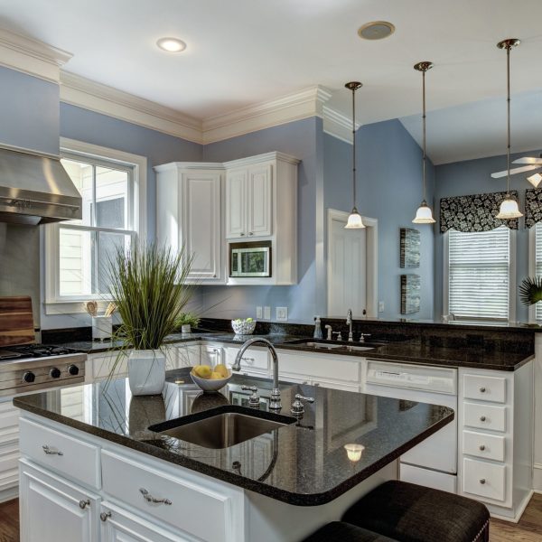 Large American style kitchen and dining room interior with granite countertops